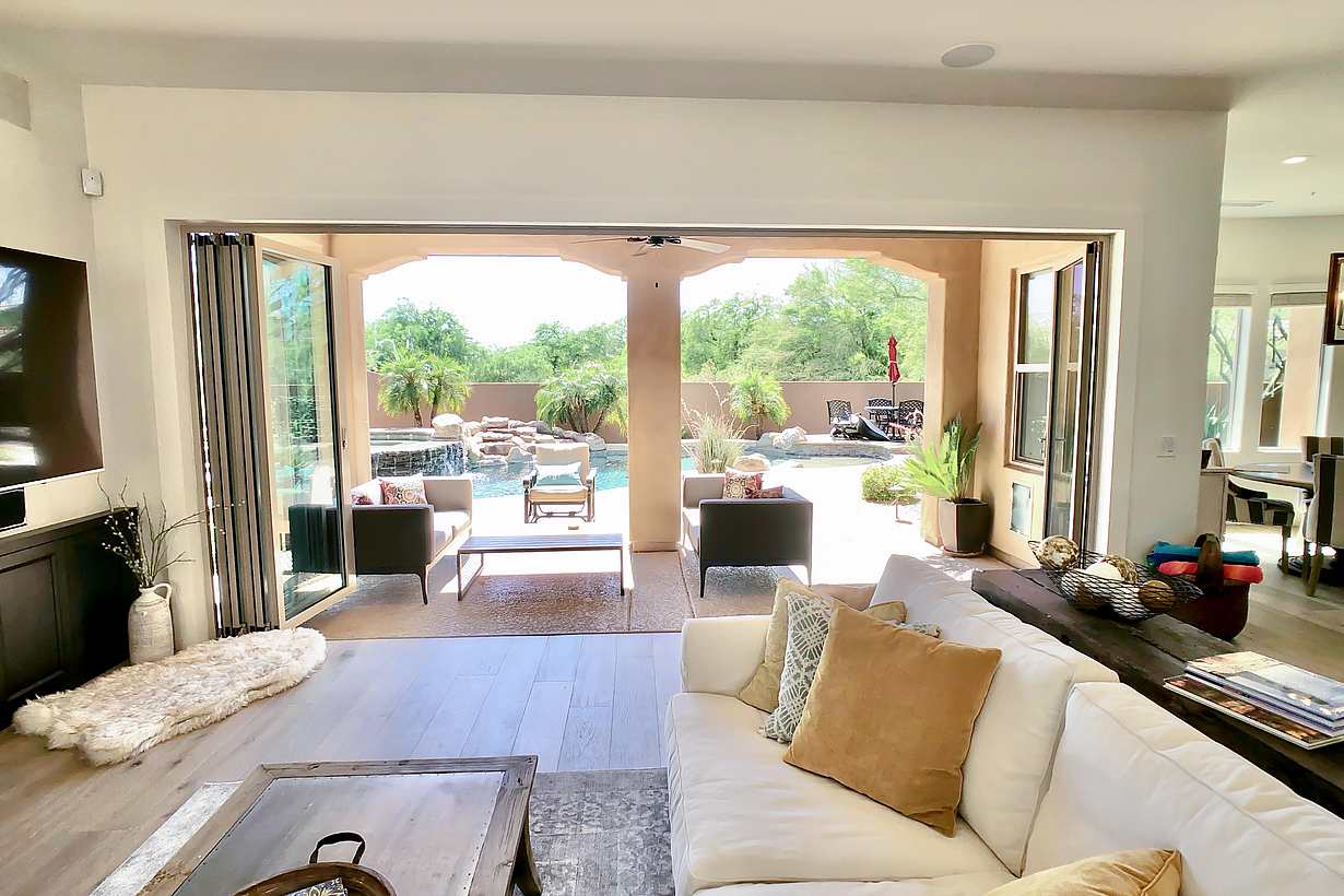 view out of remodeled family room through a folding glass wall