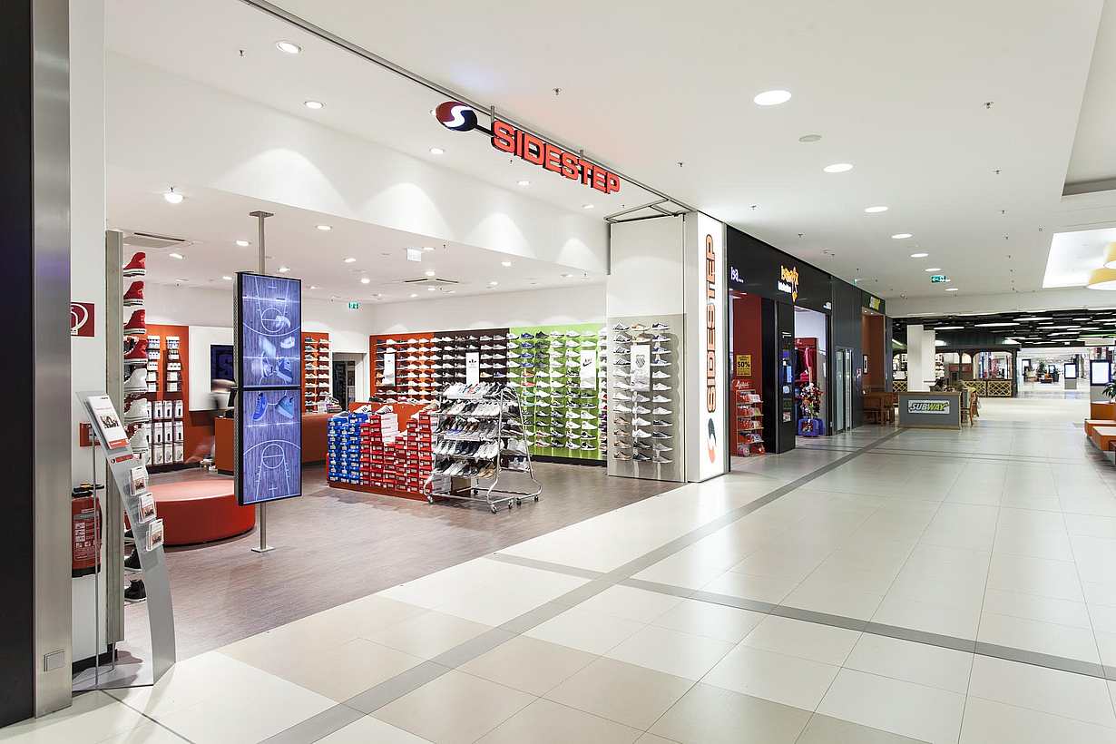 commercial design with disappearing retail storefront in a mall