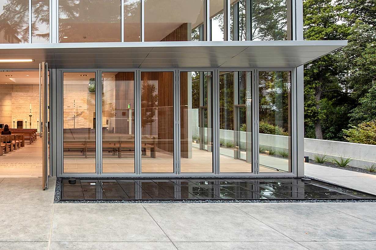 closed folding glass wall at saint mary's college high school in its student chapel