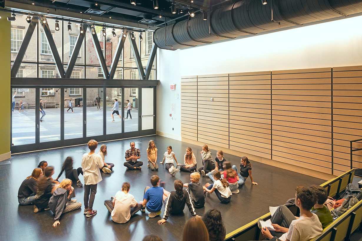 Friends Seminary great room with students in front of bifolding glass door