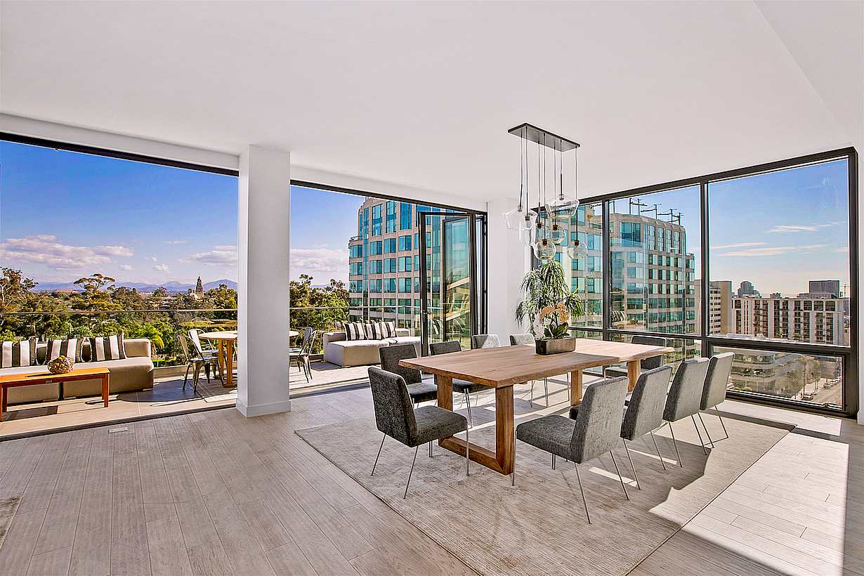 moveable glass wall systems open onto multifamily balcony