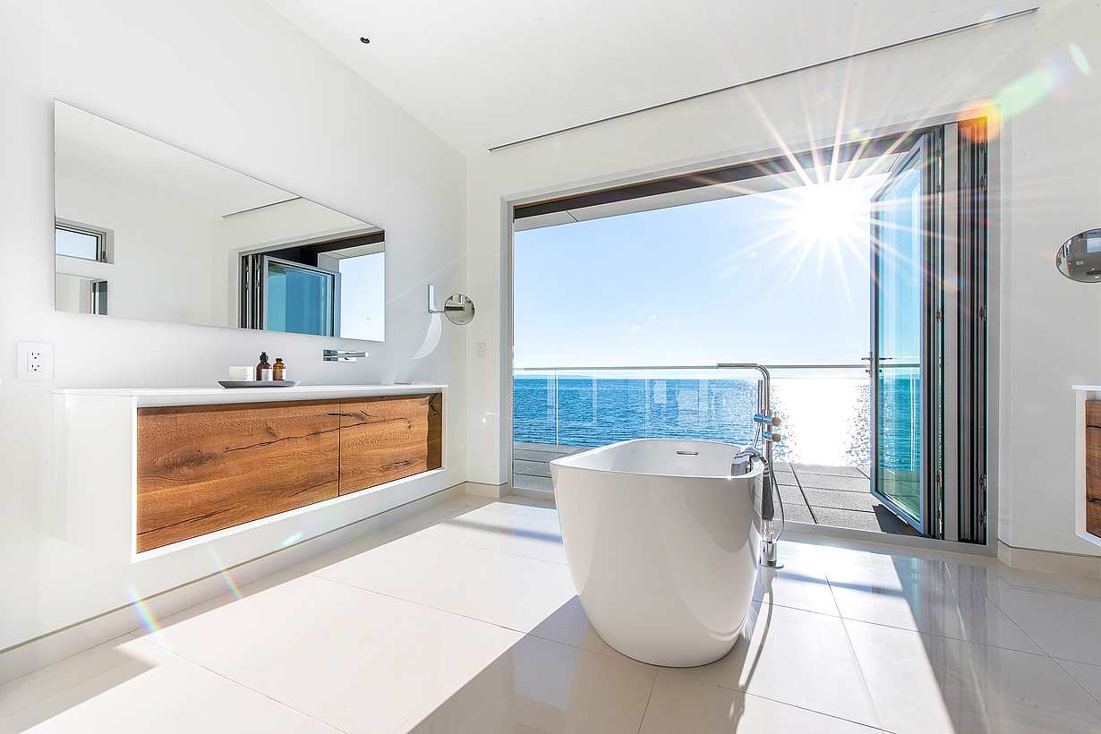 retractable glass walls create bathroom oasis
