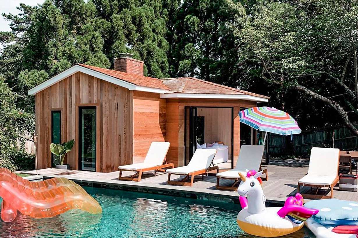cool pool house with accordion glass doors