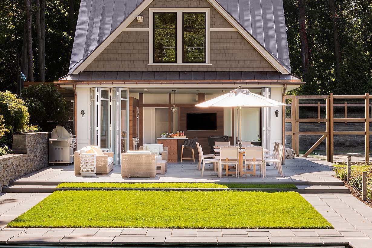 pool house with NanaWall operable glass walls