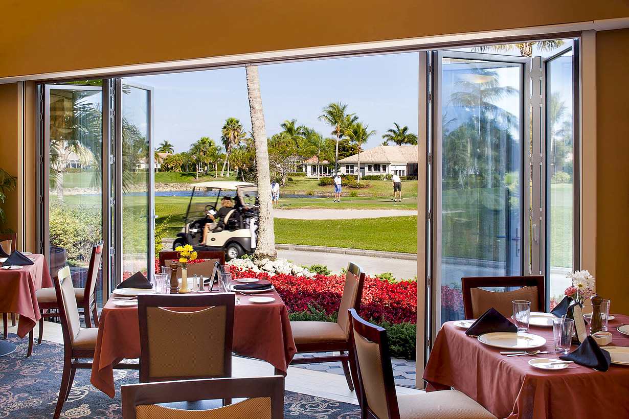 opening glass walls onto golf course