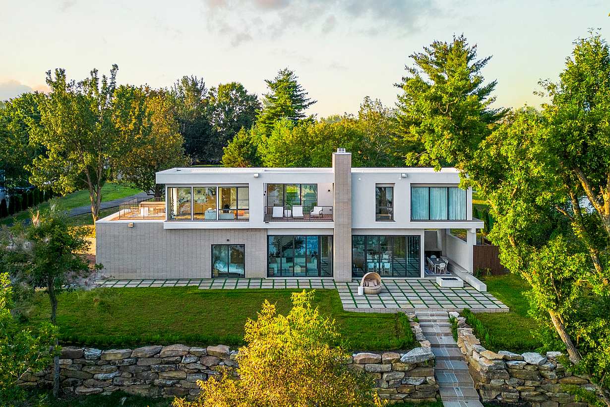 Lakefront home with glass wall systems