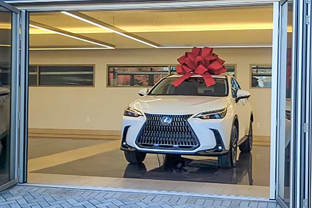 Lexus drive off experience with commercial opening glass door