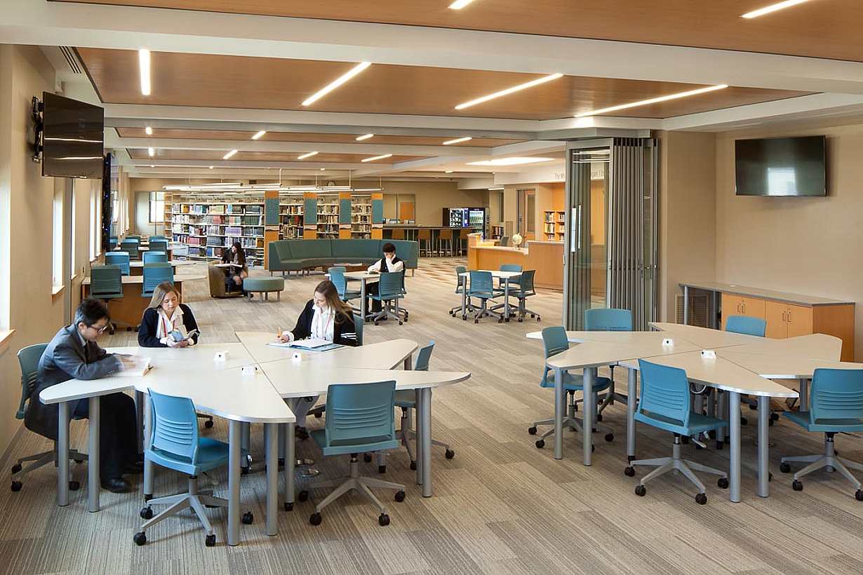 scholastic renovation in libraty with stacking glass doors