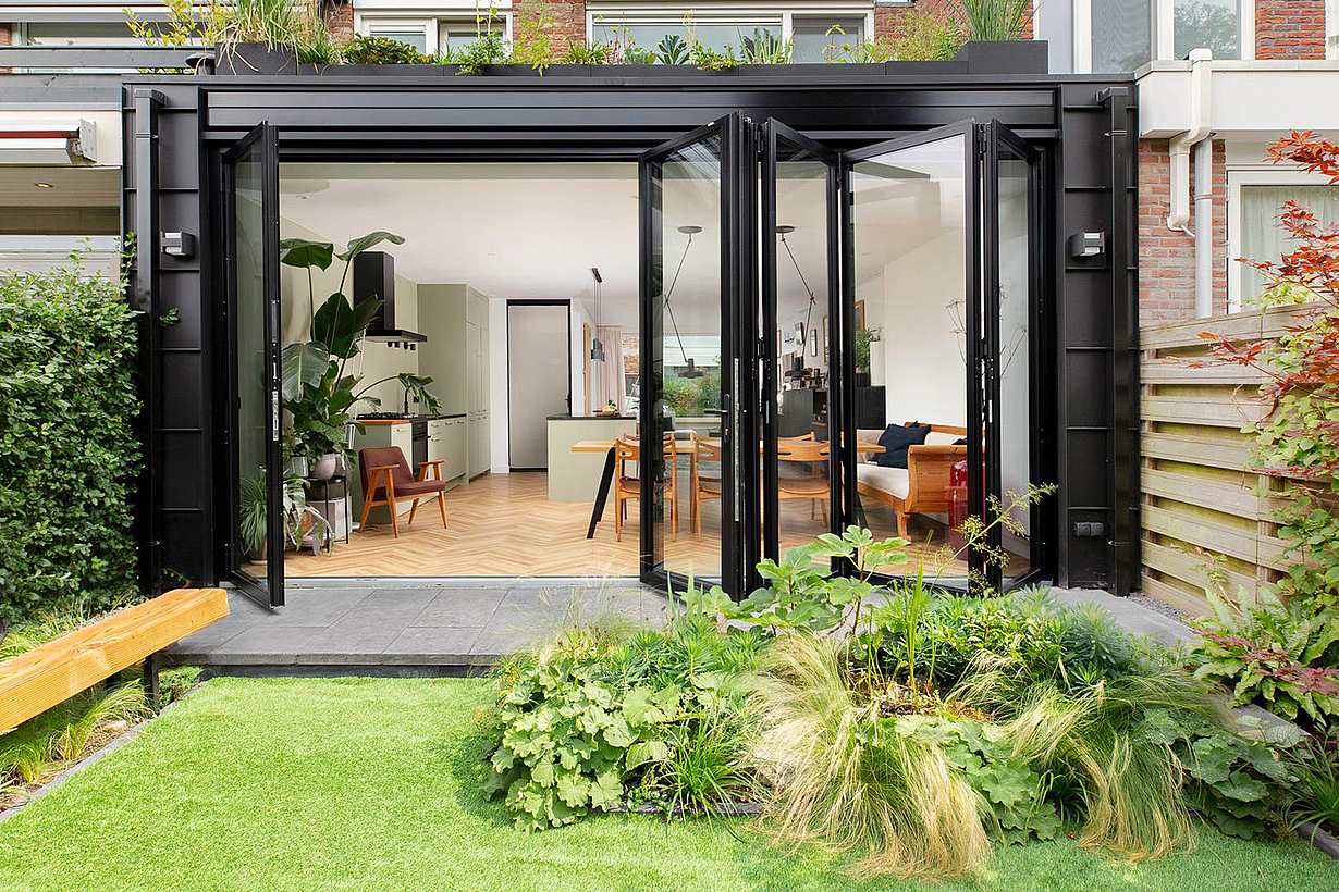 Townhouse backyard featuring folding patio doors - partially open view