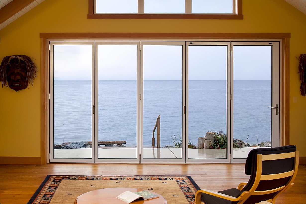 NanaWall glass wall system at a Sooke residence in British Columbia, demonstrating structural strength, weather resistance, and long-term reliability in coastal environments