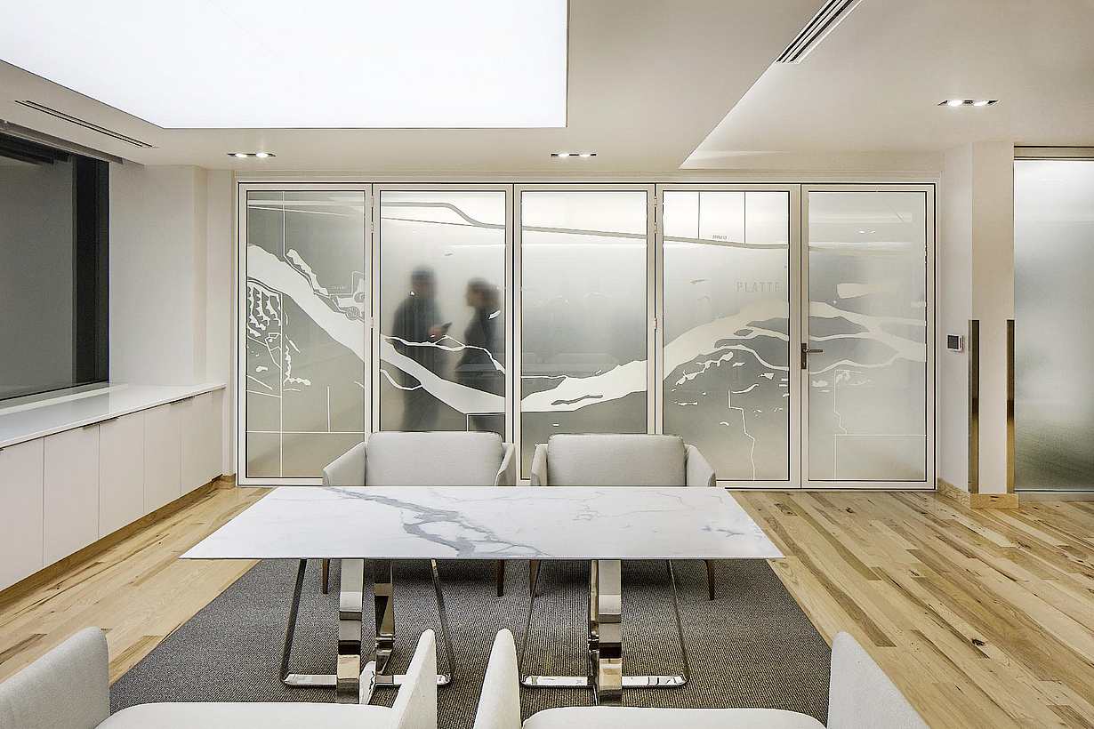 Law office reception area with NanaWall SL45 glass walls opening to adjacent workspaces