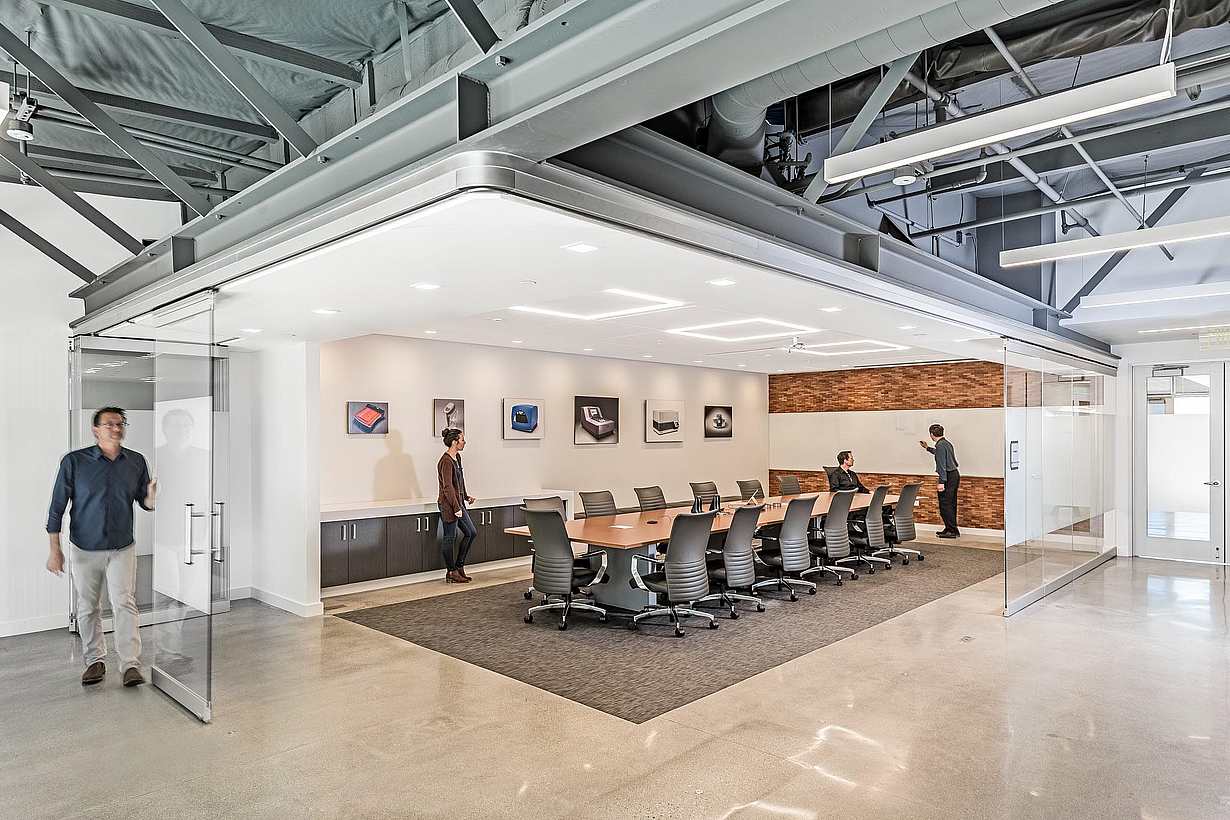 Office collaboration space with NanaWall HSW75 operable glass walls creating a flexible meeting space