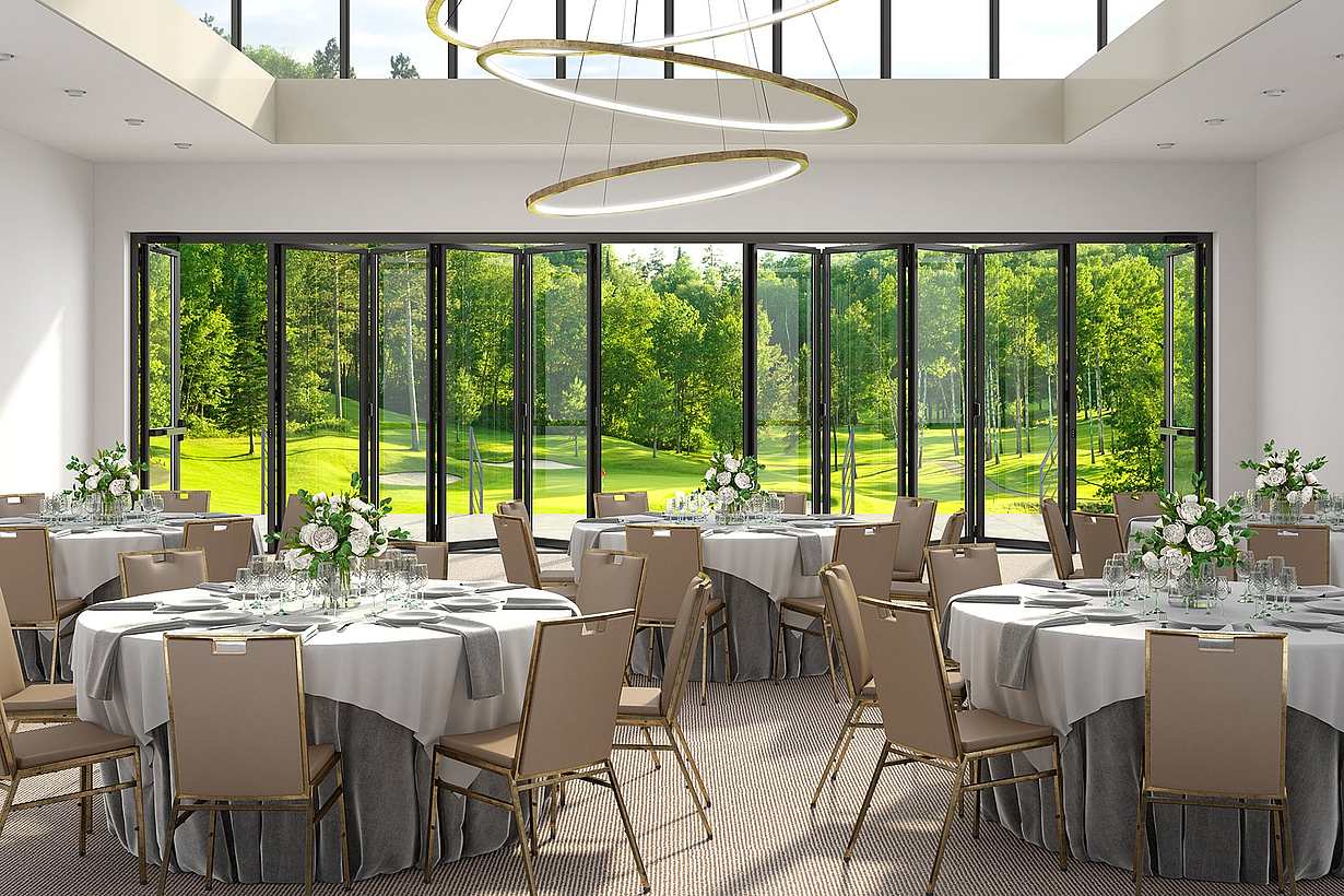 A banquet room with a view of a golf course, featuring commercial glass walls - partially open doors