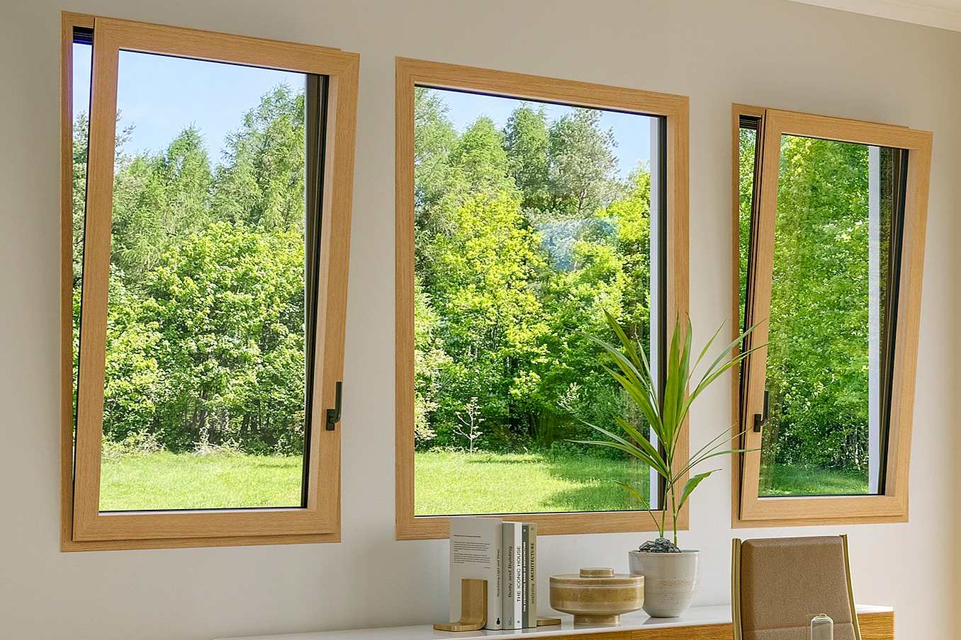 Modern living room with three wood framed tilt turn windows, two open and one closed, overlook a green lawn and trees.