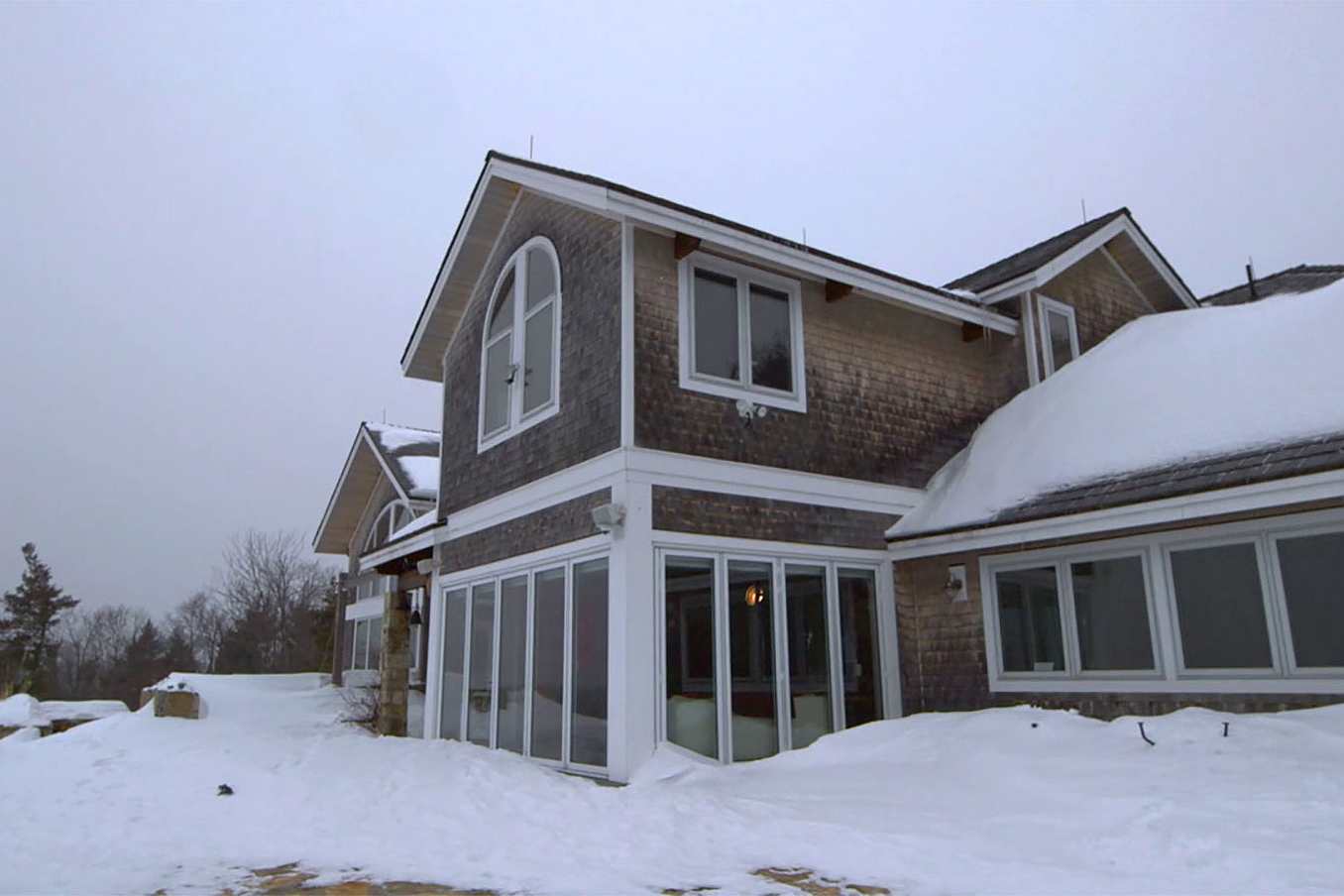Customer testimonial video featuring a NanaWall four-season glass wall room designed for cold climates and year-round comfort