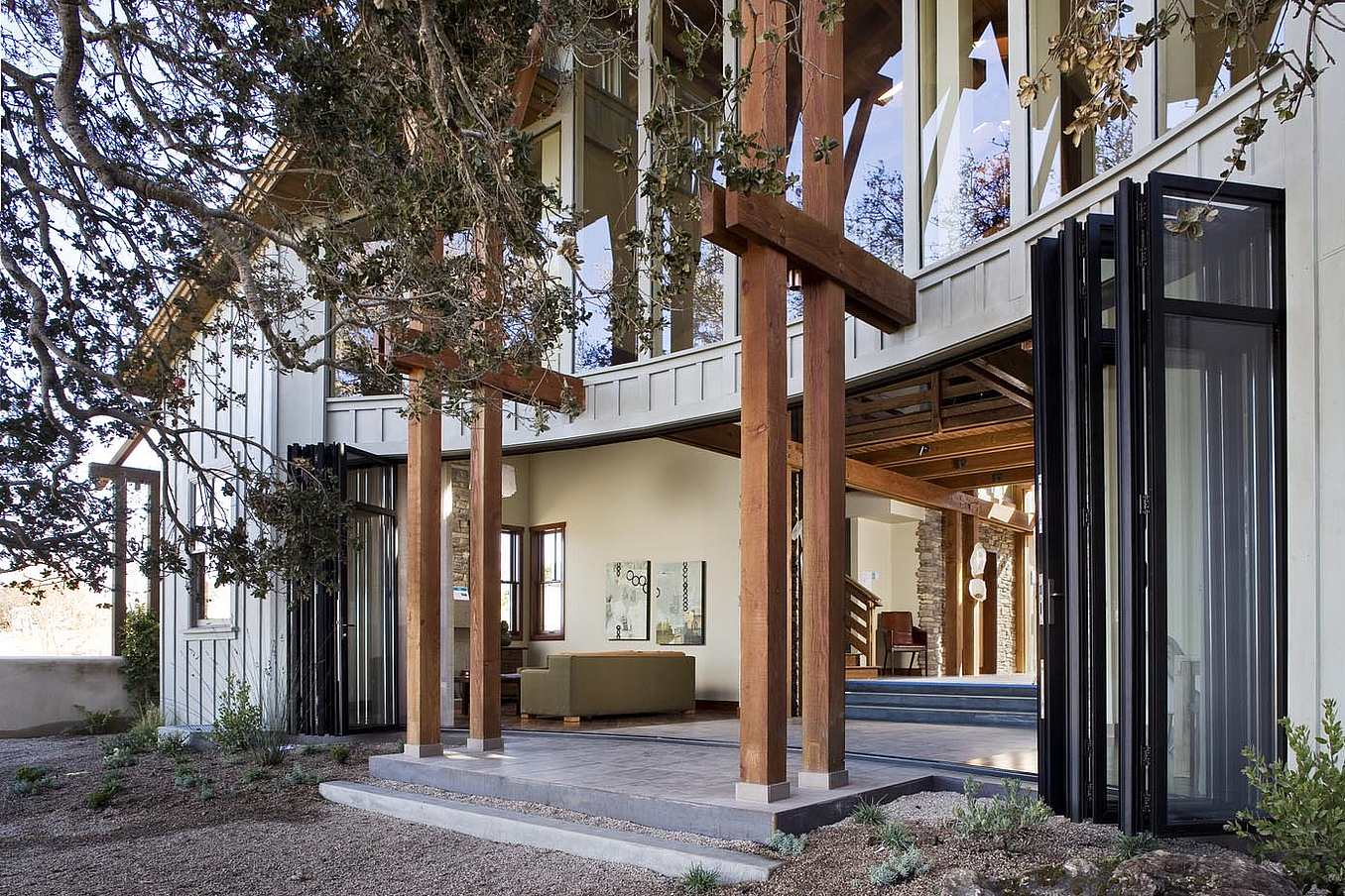 NanaWall folding glass wall system in a California coastal residence, supporting energy efficiency, weather resistance, and indoor-outdoor living