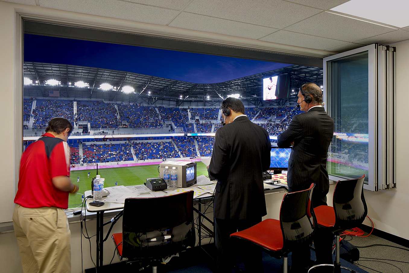 Commercial Sliding Glass Walls at NY Red Bulls stadium press box - Opened Interior Night View