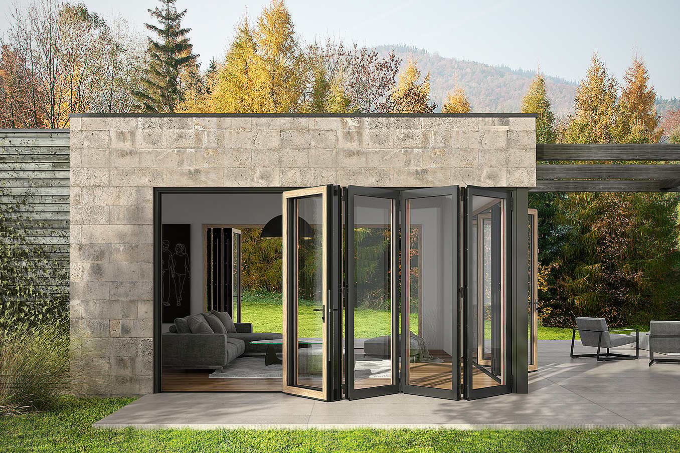 A modern ADU with open aluminum clad bifold glass doors leading from a living room to a patio, surrounded by trees and outdoor seating.