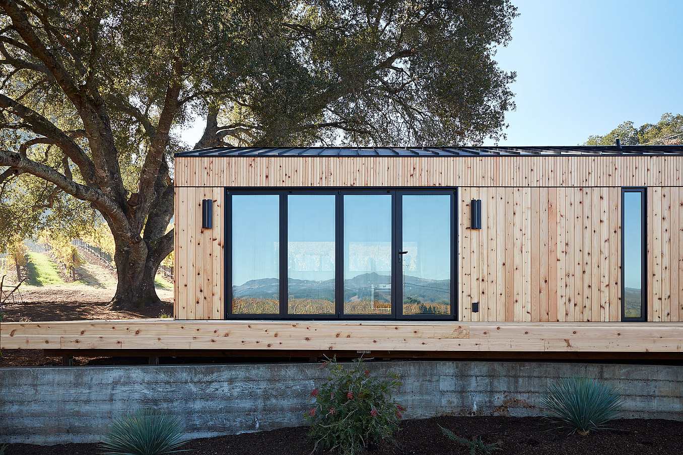 NanaWall SL60 folding glass wall system at Dwell House residence in Healdsburg, California, opening interior living space to the outdoors.