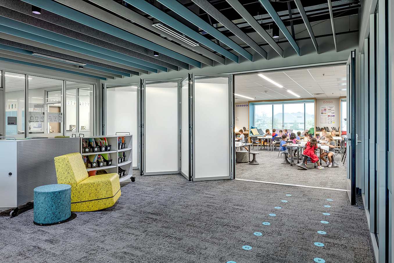 A classroom with acoustical folding glass walls