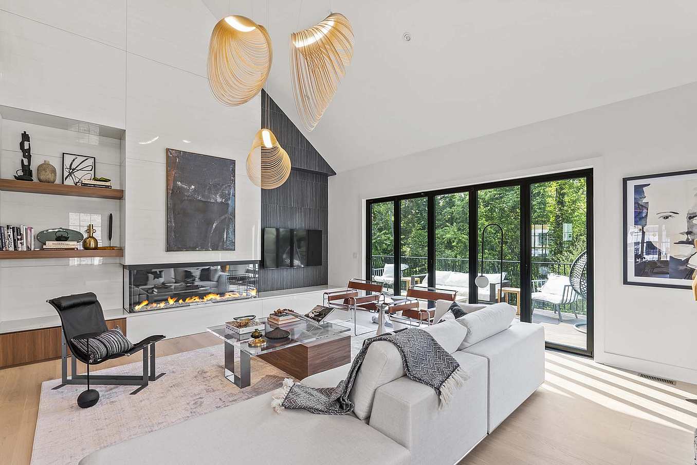 Accordion doors open to the patio, seamlessly blending indoor and outdoor spaces.