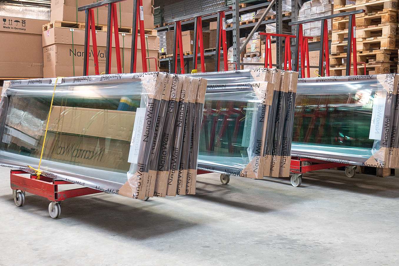 NanaWall glass panels staged for assembly and quality inspection at the Richmond manufacturing facility
