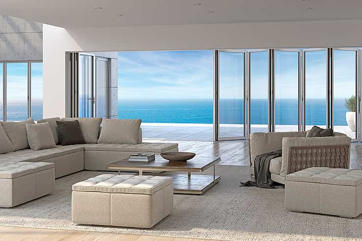 Modern  Living Room with Folding Glass Walls and a View of the Ocean