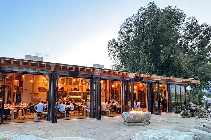 The Beach Restaurant in Buena Vista CO featuring NanaWall NW Aluminum 640 folding glass wall creating seamless indoor-outdoor dining experience