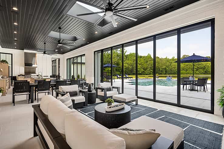 NanaWall thermally broken NW Aluminum 640 glass wall at Arlington Retreat in Arlington, TN, shown closed overlooking a pool and patio