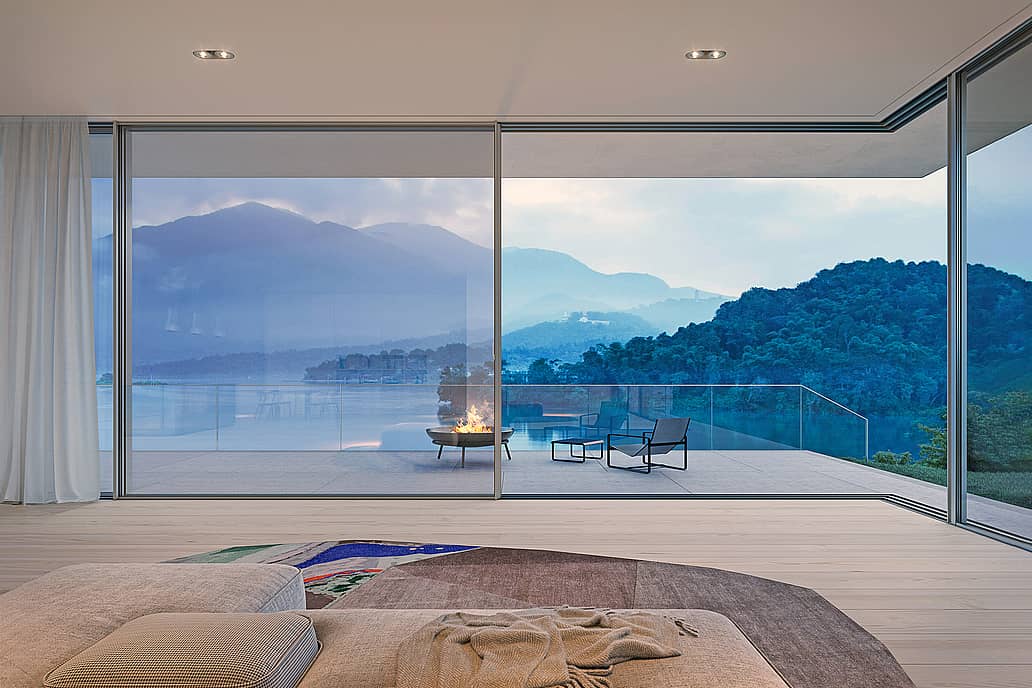 cero floor-to-ceiling sliding glass walls framing views from Walchensee Villa