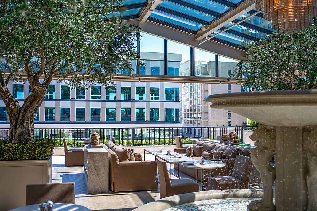 Restoration Hardware rooftop restaurant in Raleigh NC featuring NanaWall SL70 folding glass wall fully open to outdoor terrace for seamless indoor-outdoor dining