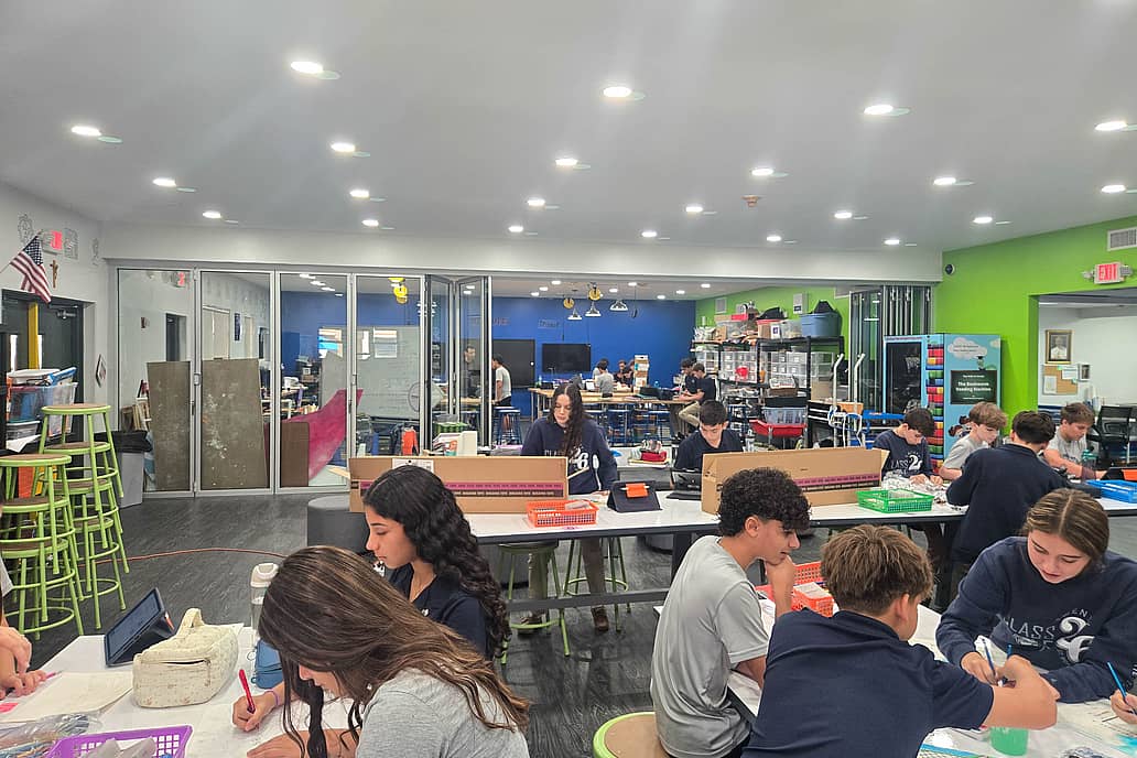 Classroom at St. Bonaventure Catholic School (Davie, FL) featuring NanaWall NW Acoustical 645 folding glass wall dividing learning zones