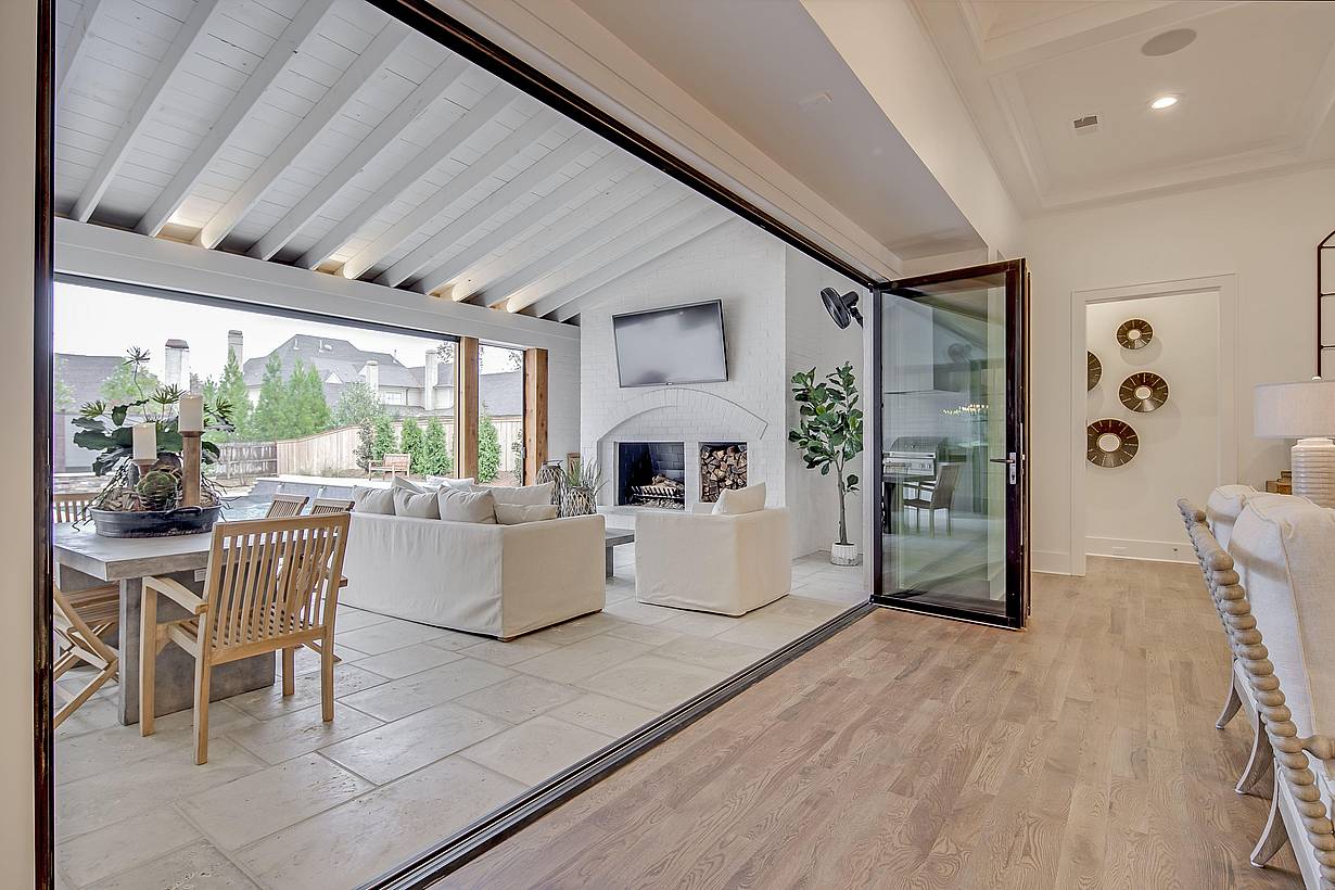 inward opening folding glass wall in a residence
