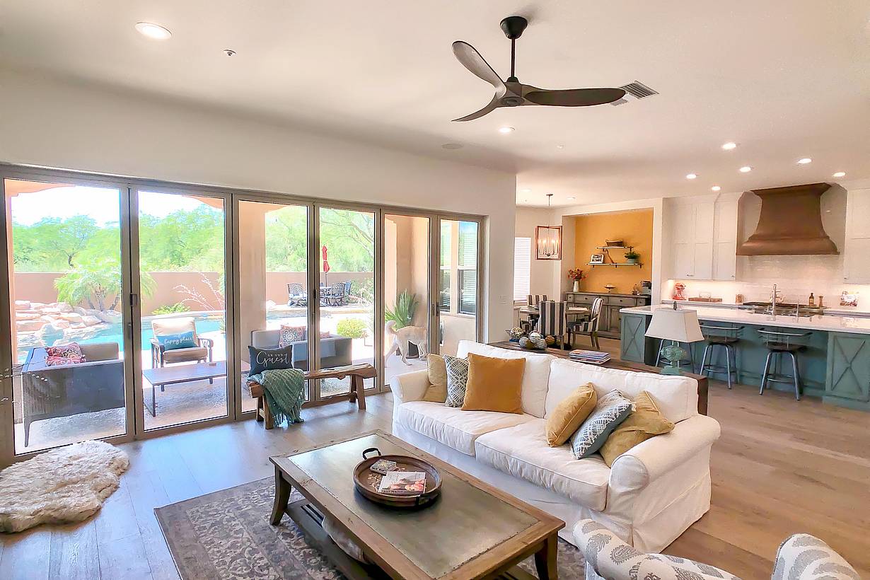 remodeled room with folding glass walls allowing indoor/outdoor lifestyle
