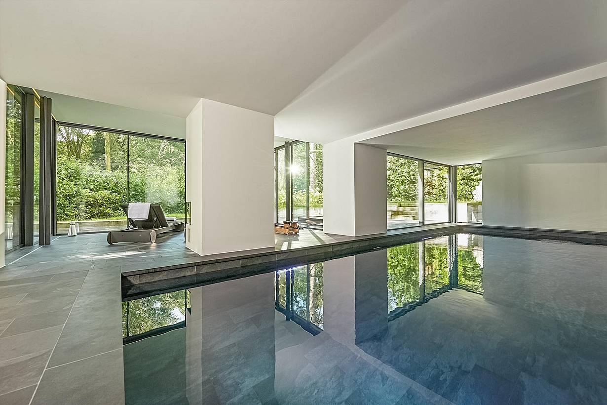 floor to ceiling cero minimal sliding glass walls in pool house