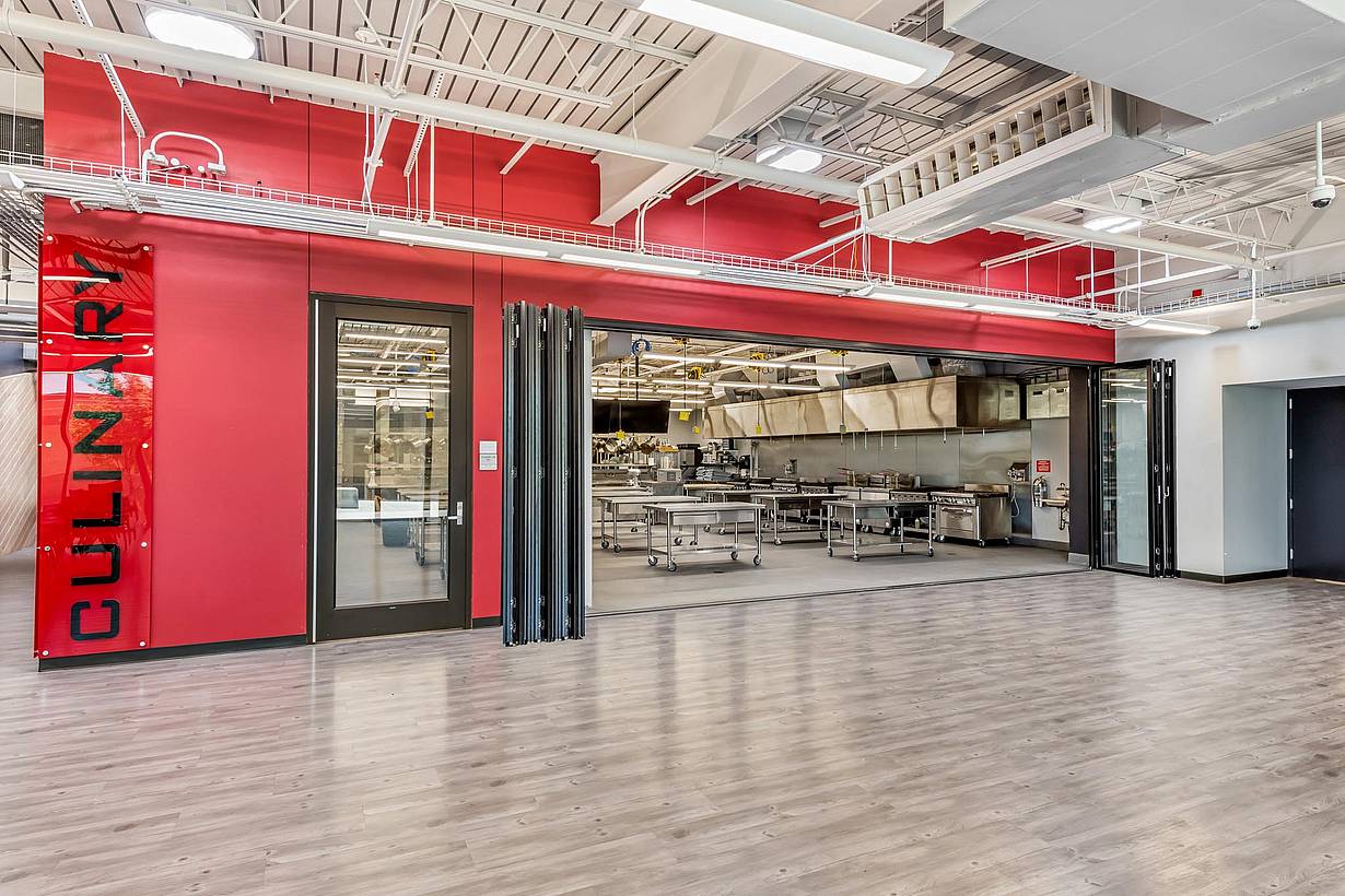 career and technical education center for high school students to learn with folding glass walls