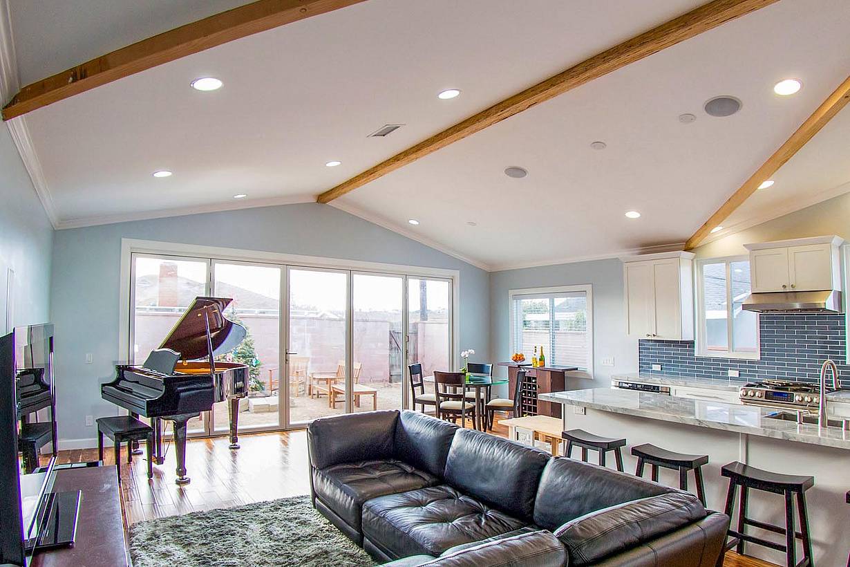 indoor/outdoor living space with operable glass wall