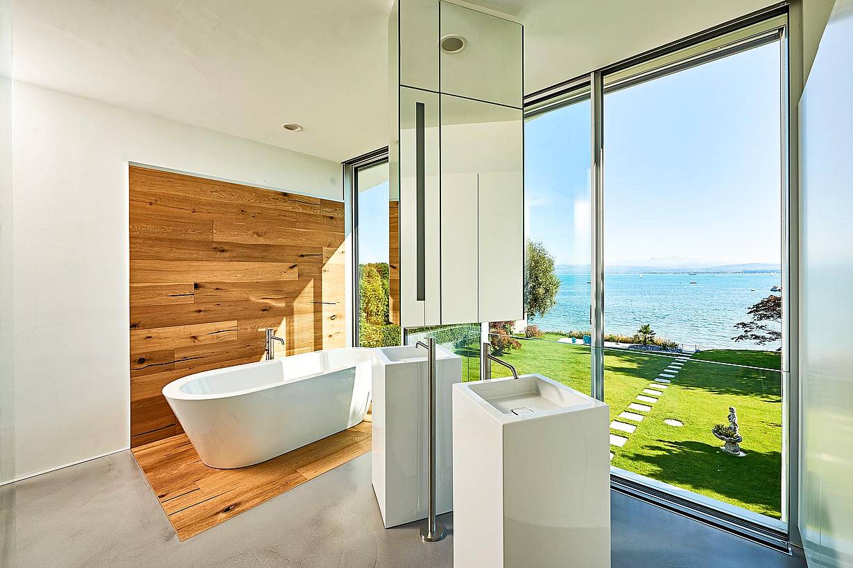 minimal framed retractable glass doors in bathroom