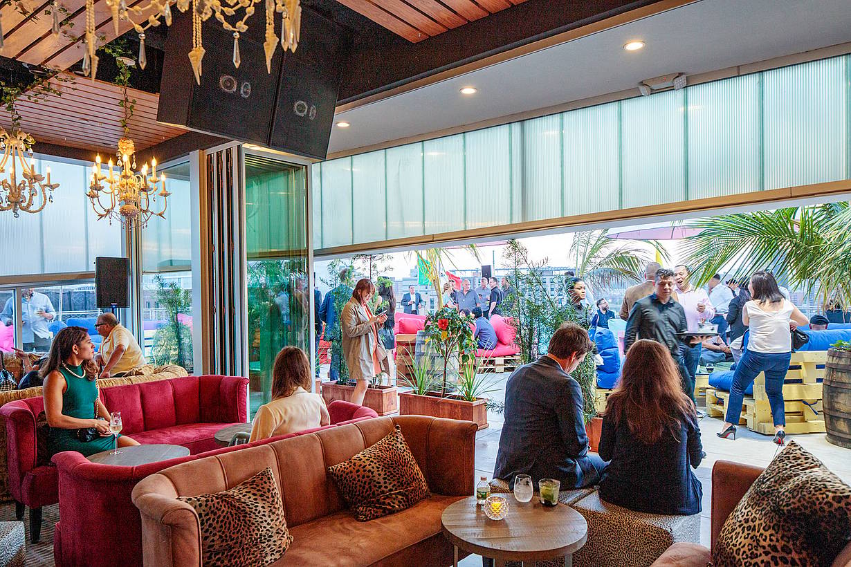 indoor outdoor rooftop restaurant with commercial folding glass doors
