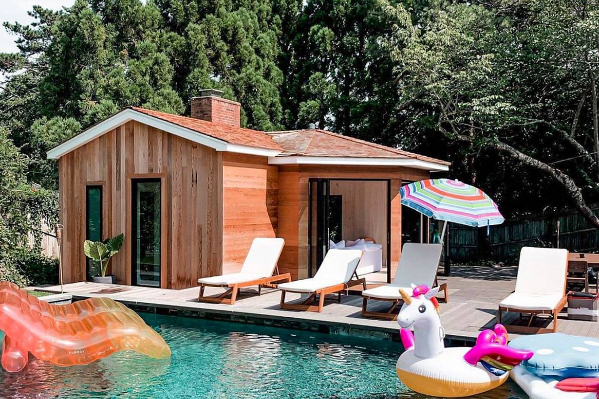 cool pool house with accordion glass doors