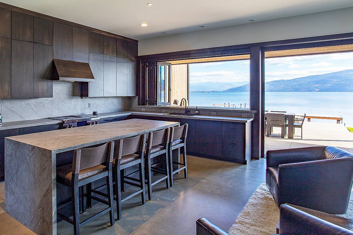 folding glass wall systems in lake home