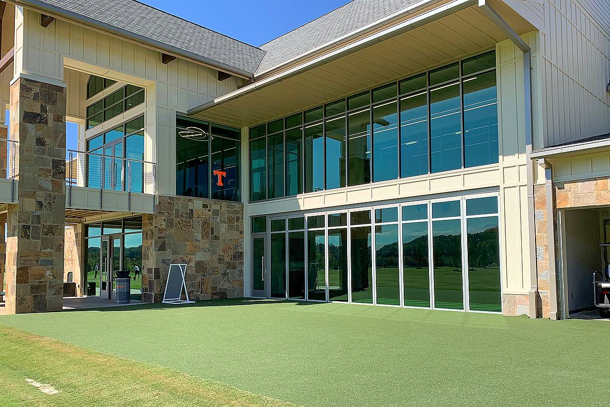 indoor outdoor putting green with NanaWall sliding glass walls