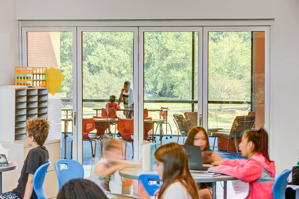 bifold glass wall system in active classroom