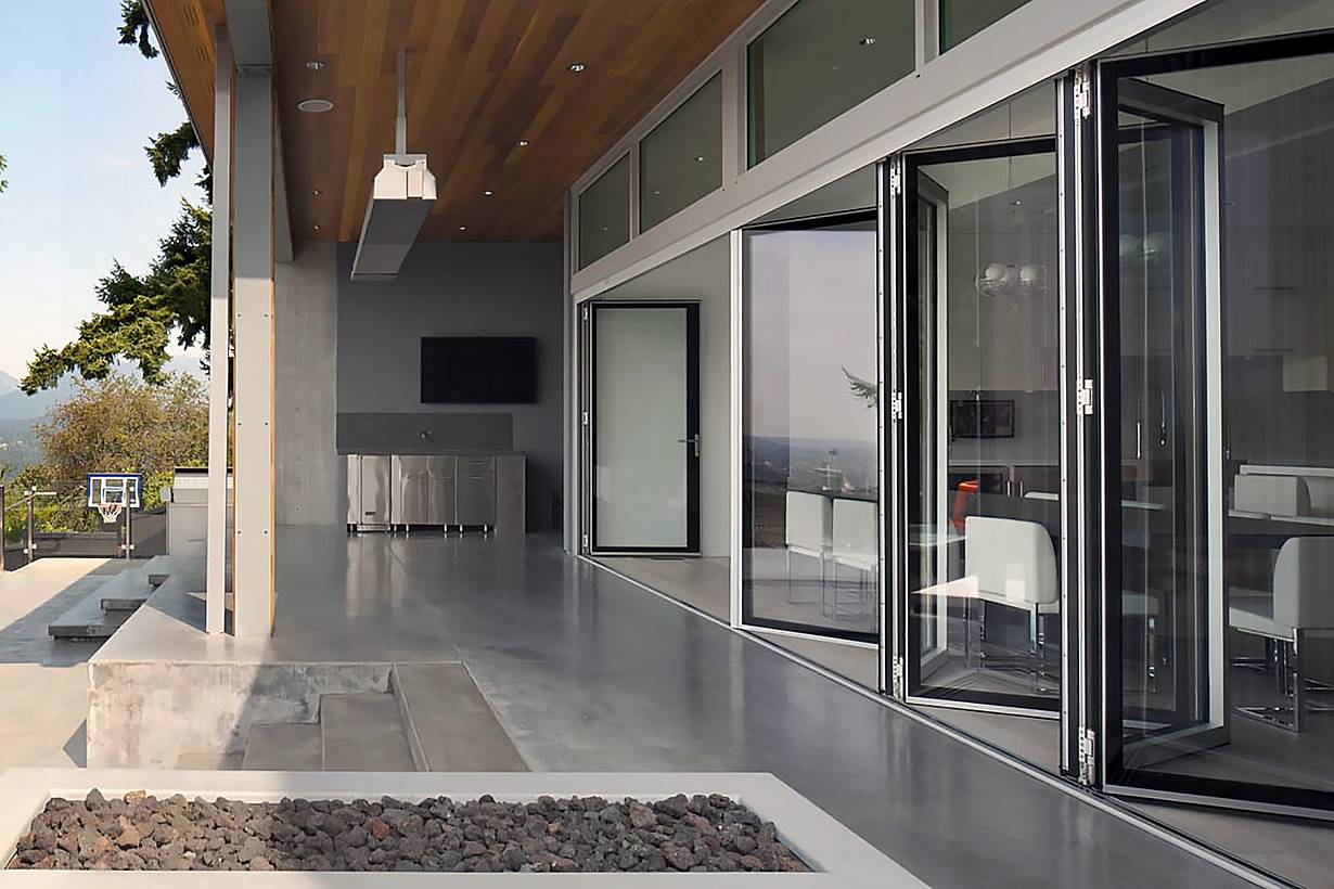 Pool house folding glass walls