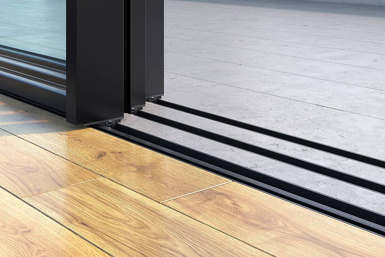 cero II minimal sill creating a low-profile transition at the sliding glass wall