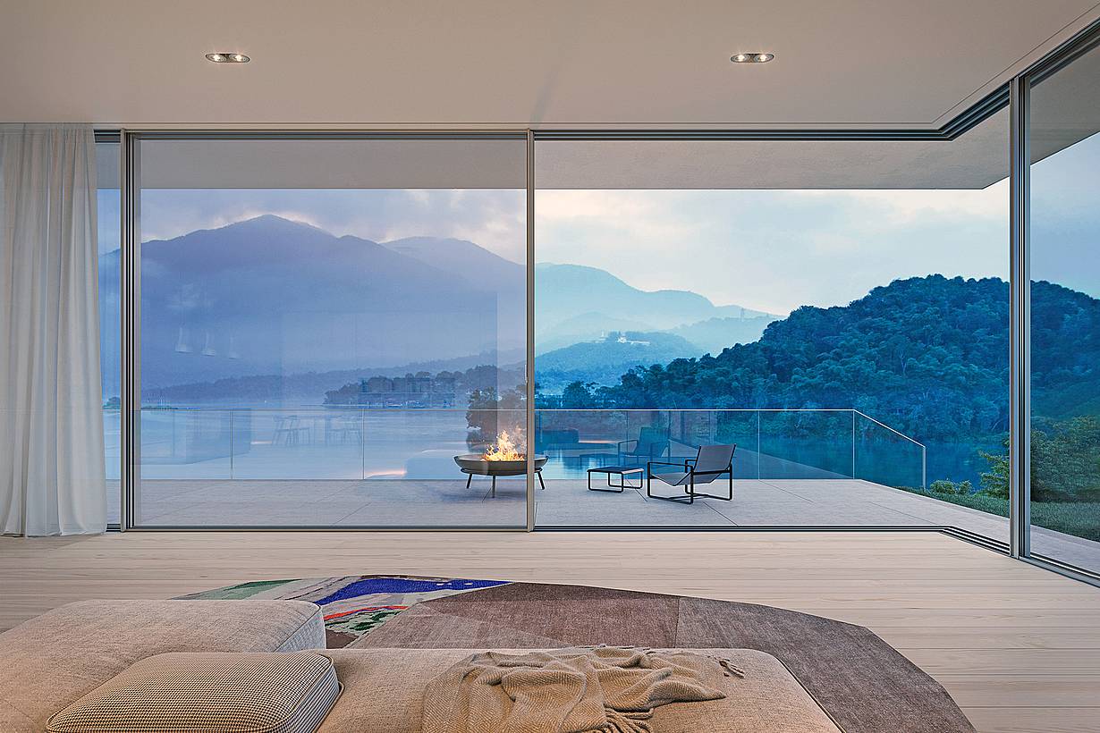 cero floor-to-ceiling sliding glass walls framing views from Walchensee Villa