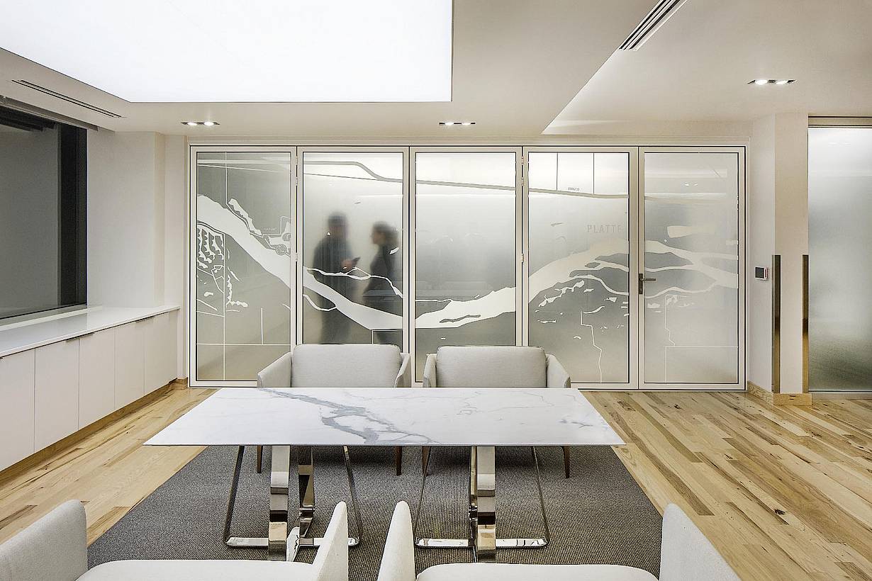 Law office reception area with NanaWall SL45 glass walls opening to adjacent workspaces