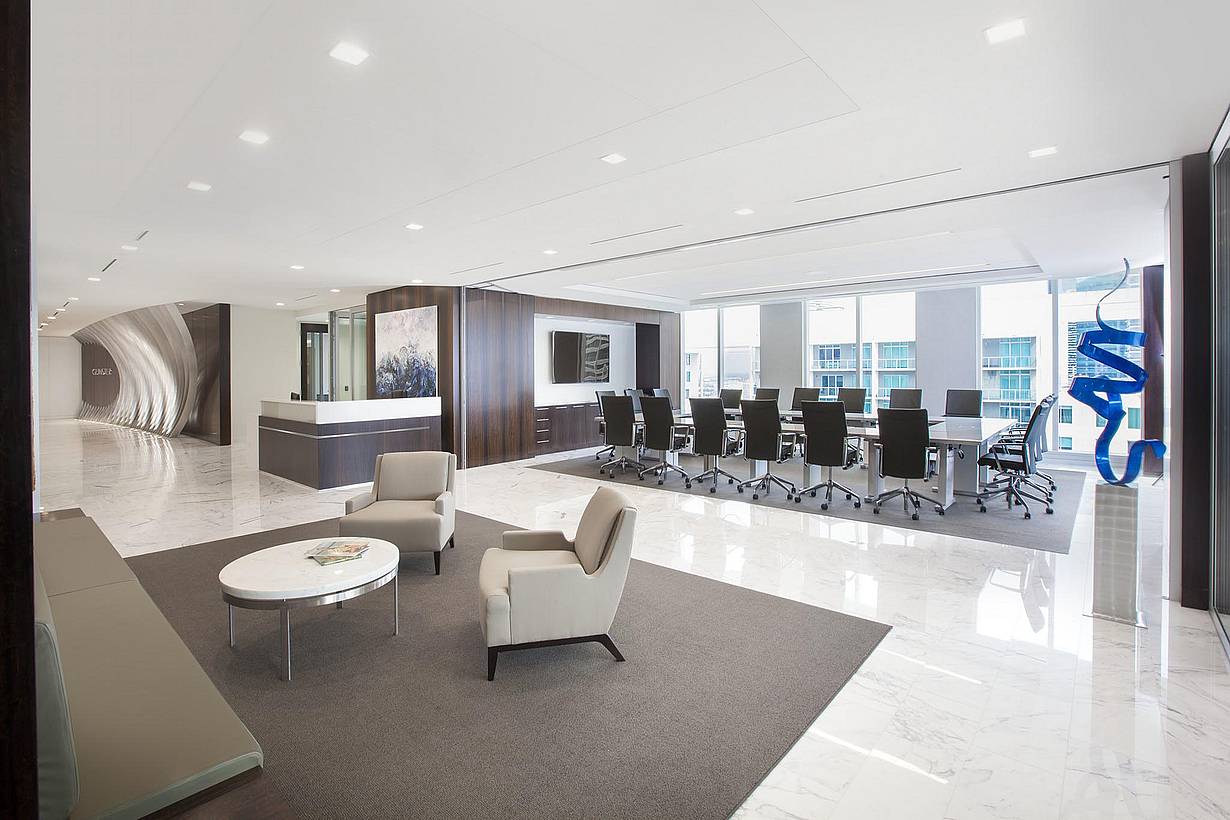 Professional office interior with HSW60 operable glass walls dividing workspace and conference area