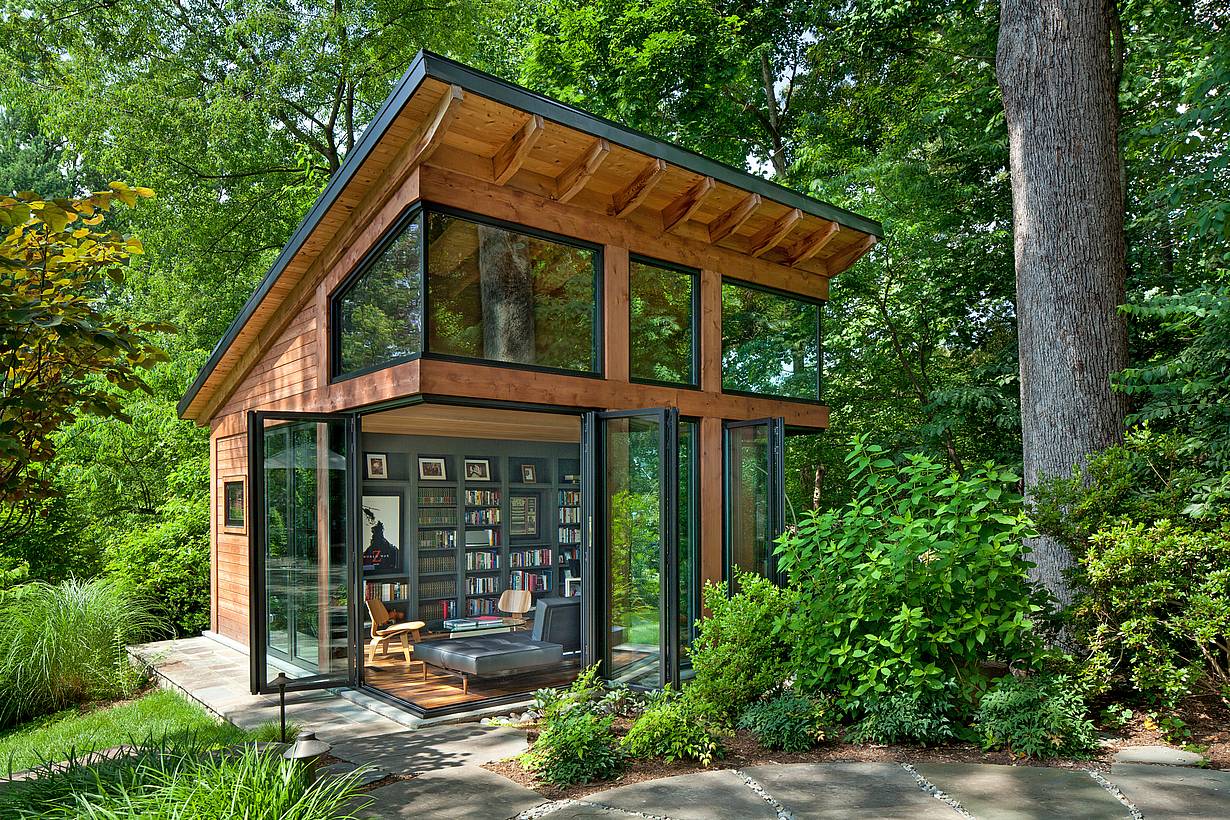 Open-corner accordion glass patio doors in Arlington, VA ADU expand living space into the garden, creating seamless indoor-outdoor flow