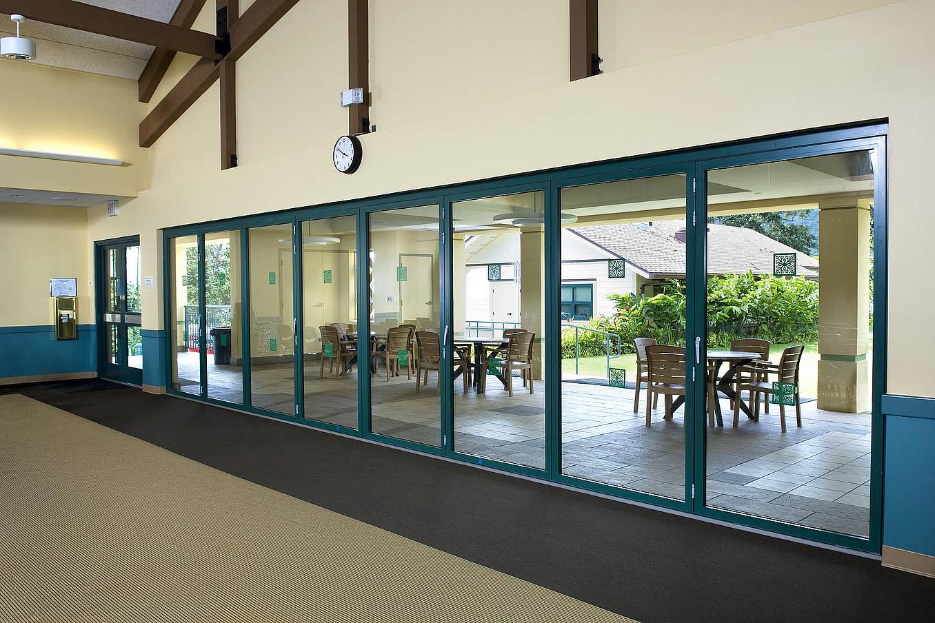 NanaWall SL45 at Hawaii Baptist Academy, HI, featuring slim-profile folding glass walls with thermal performance and custom wood finish